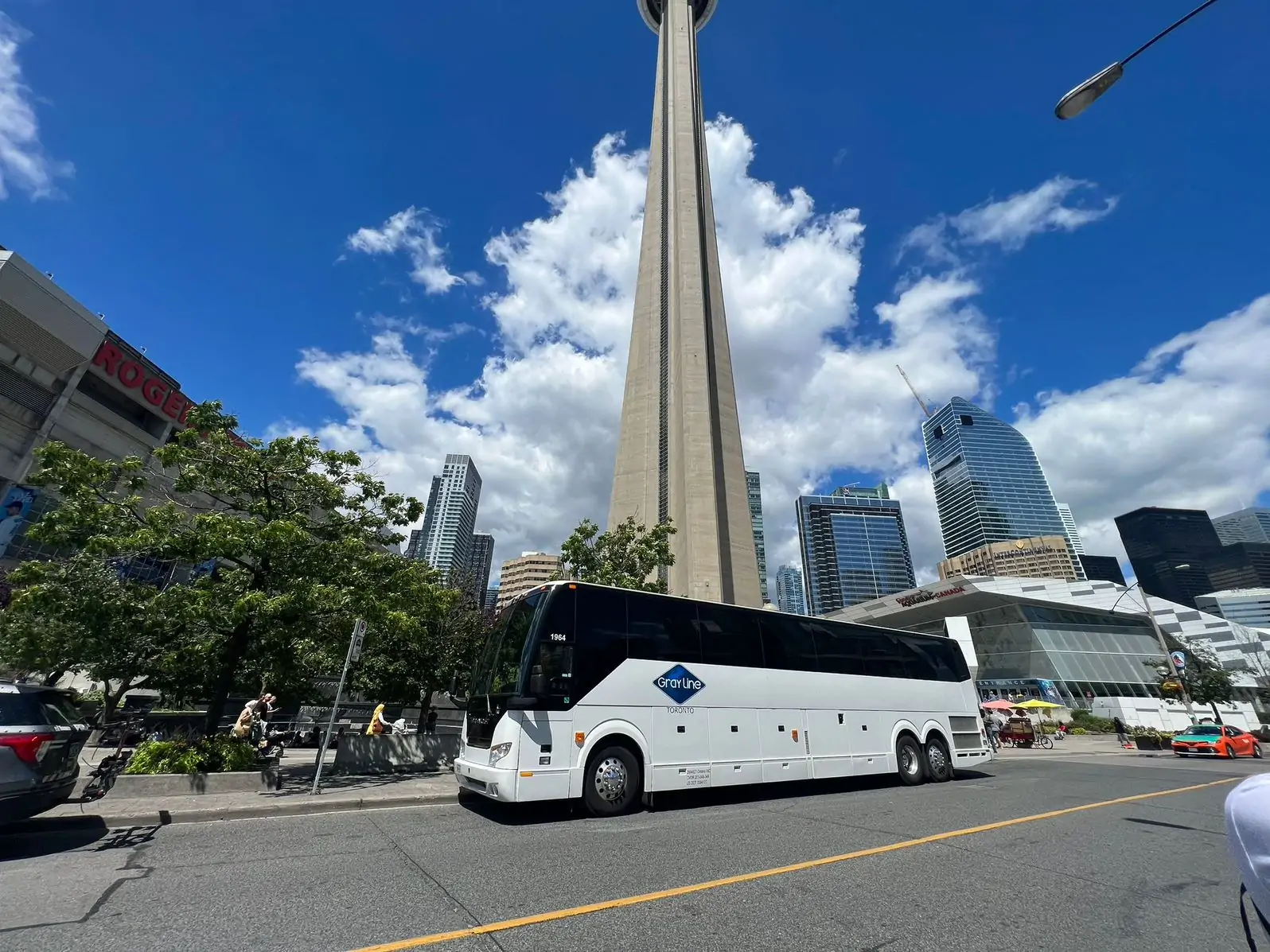 Gray Line Toronto Coach bus parked outside CN Tower
